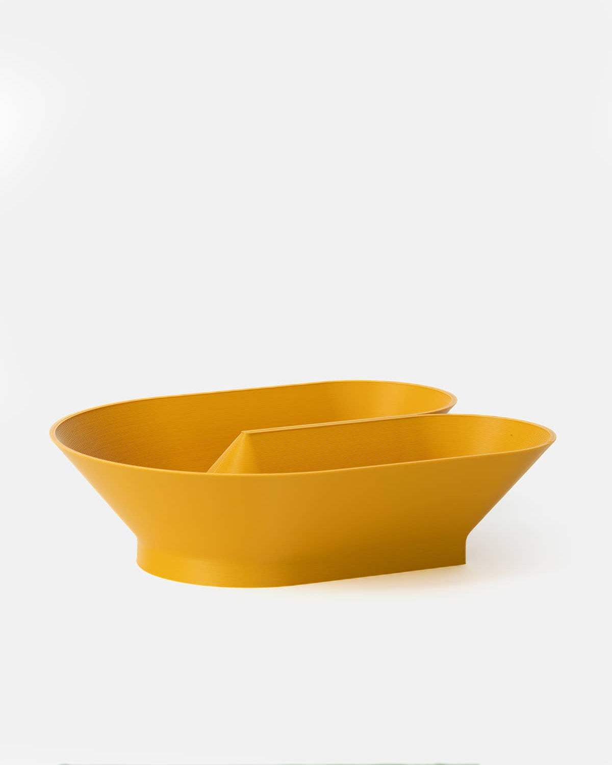 U Bowl modern sculptural fruit bowl in yellow ochre  by Cyrc